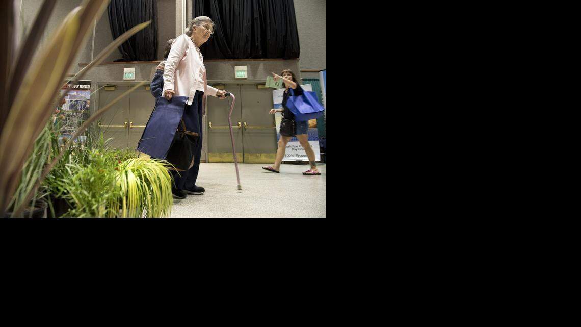 
Cecile Whitaker of Atwater looks at drought-tolerant plants at the Modesto Landscapes booth at Stanislaus County Home Show at the Modesto Centre Plaza on Friday.
