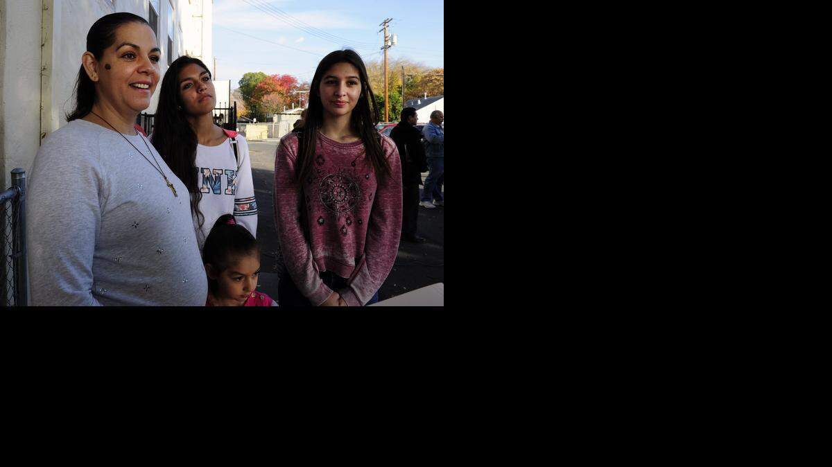 
Gloria Sanchez and her daughters Khiabet Sandoval, 16, Gloria Sandoval, 5, and Flor Sandoval, 14, are pictured Friday at a small rally for immigration reform at Central Grace Community Church.
