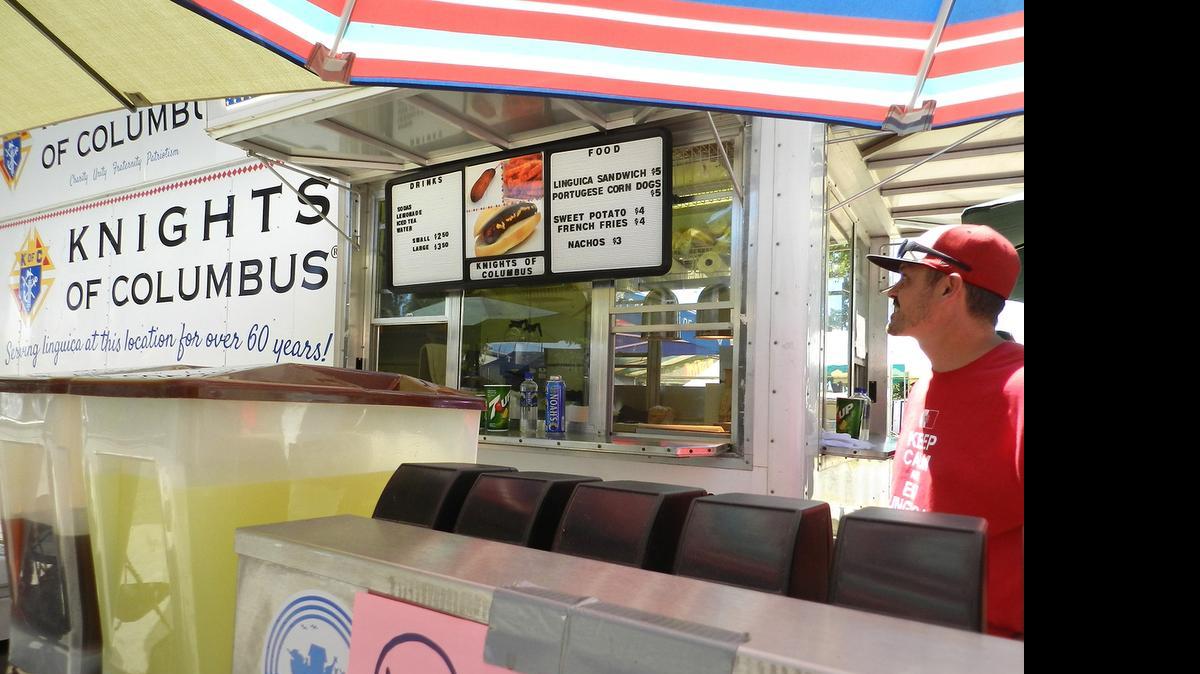 
Kevin Crivelli works the Knights of Columbus booth at the Stanislaus County Fair in Turlock on Wednesday. 
