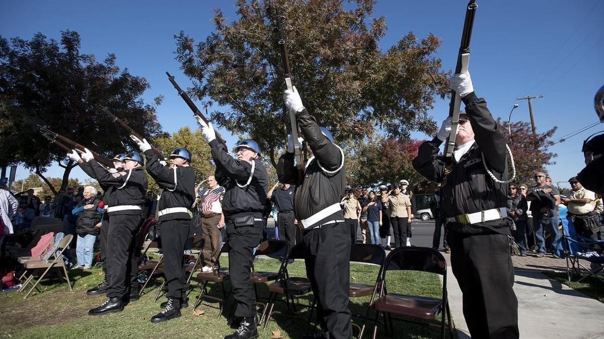 The San Joaquin Valley National Cemetery Memorial Council Honor Guard performs a 21-gun salute as Turlock honors local veterans in Central Park on Wednesday, Nov. 11, 2015.