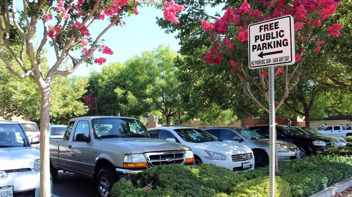 Cars fill a free public parking lot at Thor Street and Crane Avenue, one of 12 city-owned lots in downtown Turlock, Calif., on July 6, 2016.