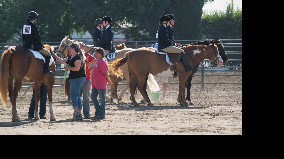 
Riders wait near the entrance gate to the arena during the 4-H/FFA English horsemanship riding competition as part of the pre-fair horse events last year in Turlock.

