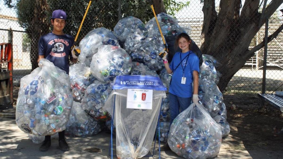 Daniel Olivas and Katie Overton with the recyclables they collected.