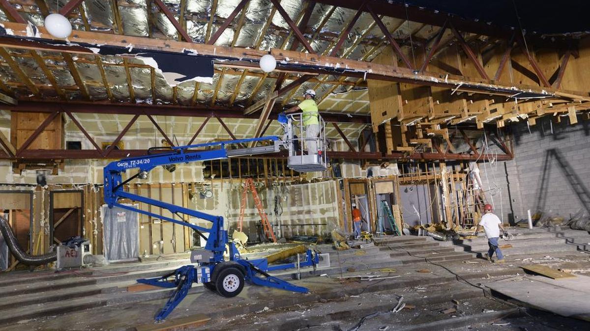 
Workers in July 2014 remove walls and the ceiling as part of the renovations to make a more open plan in the Performing Arts building at Turlock High School. The building is almost finished, waiting only on audience seating.
