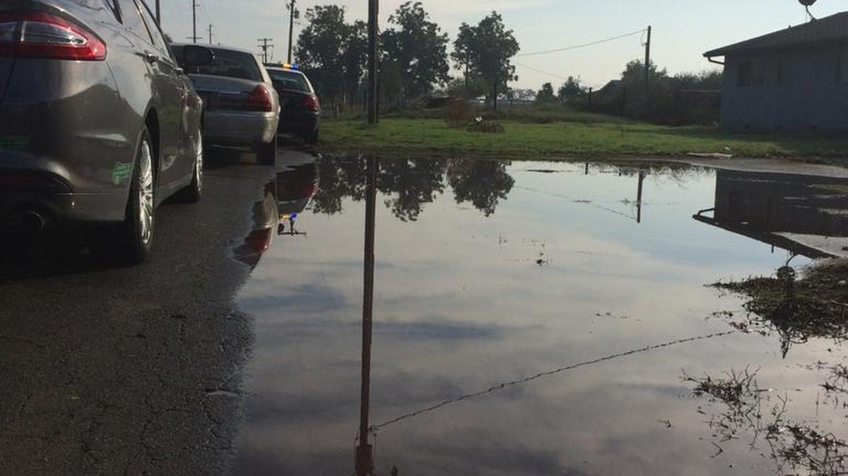 A dairy pond levee along the 4200 block of West Linwood Avenue in Turlock broke Friday morning, flooding surrounding streets and threatening residences with potentially soiled water.