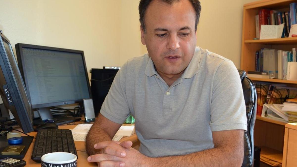 Gökce Soydemir, a professor at California State University, Stanislaus, discusses his business forecast report on the San Joaquin Valley in his office on the Turlock campus on Wednesday, Nov. 4, 2015.