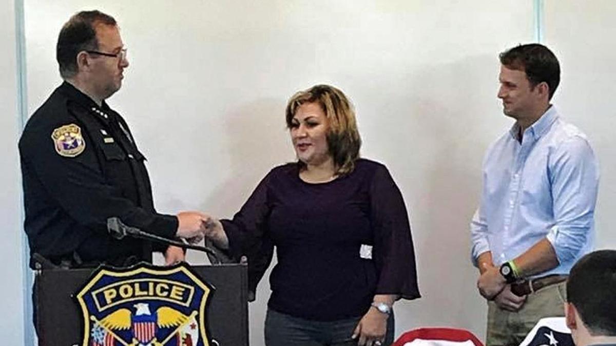 Ana Ramirez's heroic act Ð fighting off two pit bulls who were attacking a boy ÐÊwas acknowledged by the Turlock Police Department with a Commendation Award. Chief Nino Amirfar and Mayor Gary Soiseth were on hand.