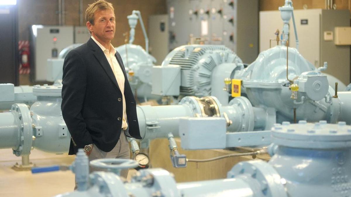 Turlock Director of Municipal Services Michael Cooke stands in front of one of the city's water pumps in 2013. Cooke has been named interim city manager, stepping into the role Dec. 8.