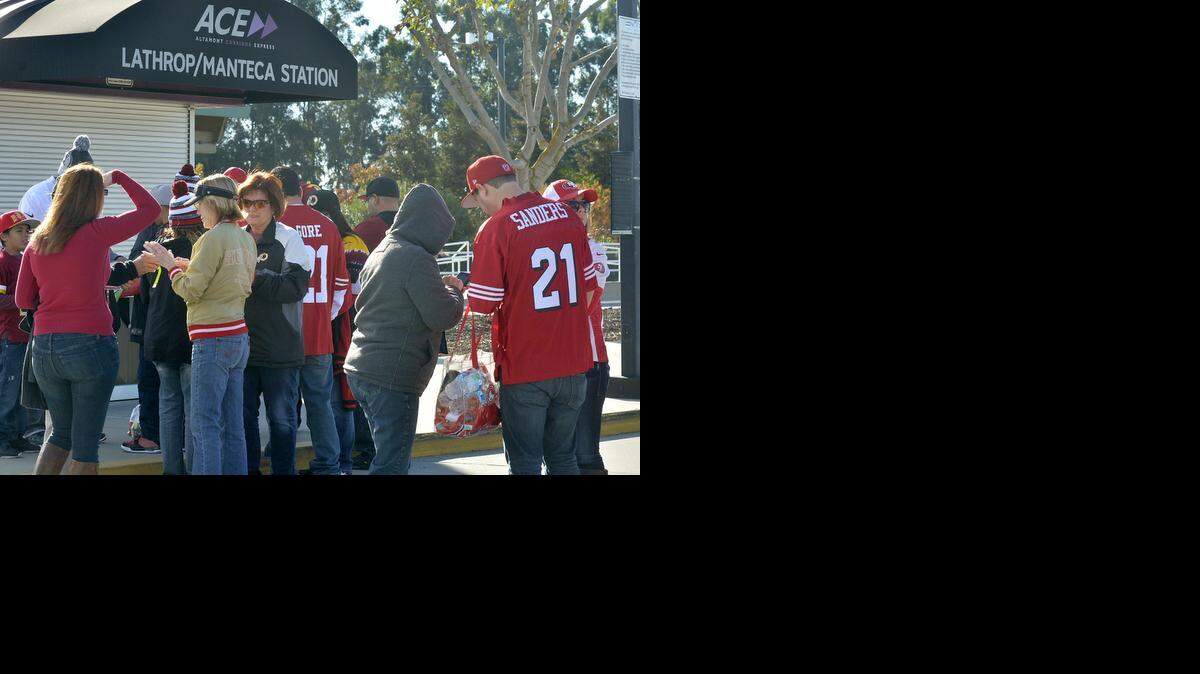 
Football tickets holders gather to have their train tickets scanned at the Lathrop/Manetca ACE station. Riders boarded the Altamont Corridor Express ACE train to attend the San Francisco 49er's game at Levi's Stadium, Nov. 23, 2014.
