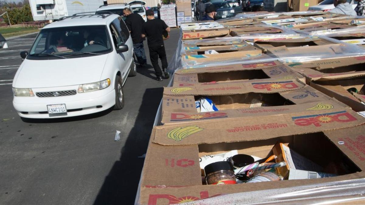 Three sections of food lined an assembly line to distribute boxes of food to needy families. Westside Ministries in Turlock partnered with the Fancy Food Show in San Francisco to receive food for needy families. It was distribution day Sunday for nearly 500 families, according to staff.