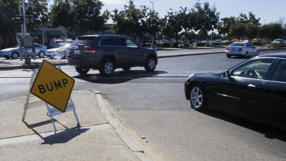 After the railroad company finished maintenance on its tracks at Golden State Boulevard and Monte Vista Avenue, the tracks were 1 to 3 inches higher.
