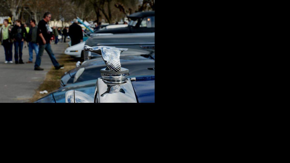 
 The hood of a 1931 Model A Cabriolet shines as people gather during the 2012 Turlock Swap Meet.
