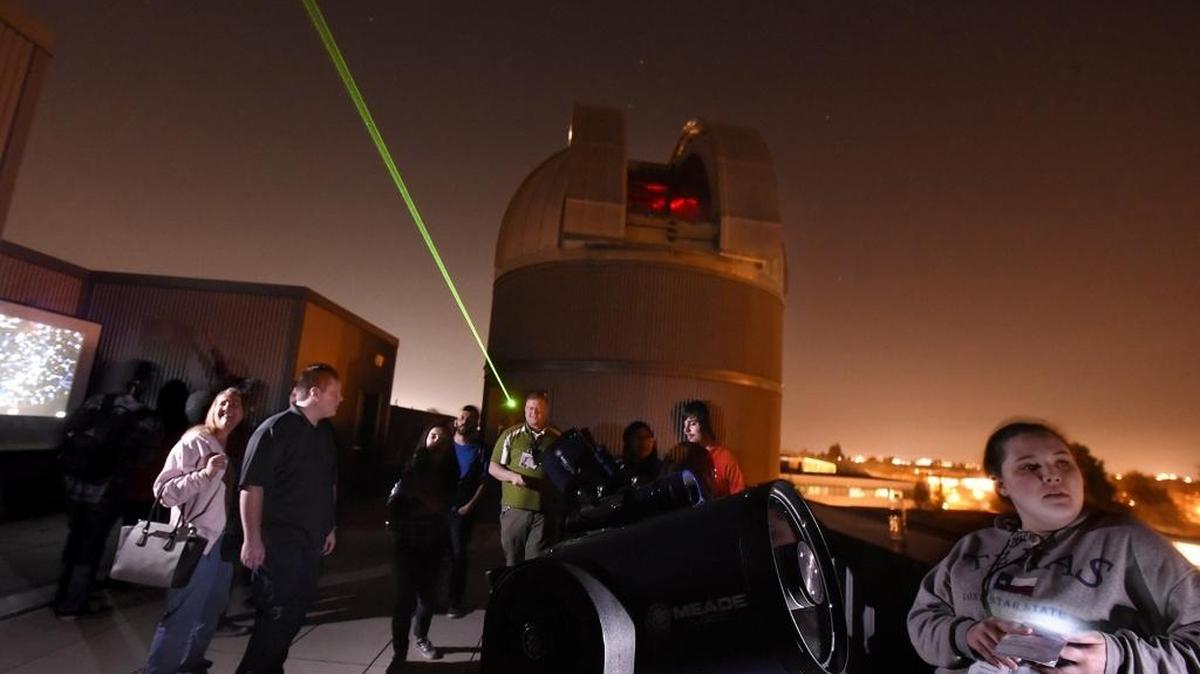 Physics students, instructors and guests stargaze atop the Naraghi Hall of Science at the observatory at California State University, Stanislaus, in Turlock on Thursday, Feb. 25, 2016.