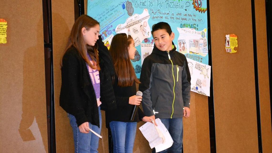 Brown Elementary student body officers, from left, Genesis Ellis, Alondra Zaragoza and Rocco Perez talk to fifth- and sixth-graders at the school about how dirty air can make kids sick during an air quality assembly Thursday, Jan. 14, 2016.