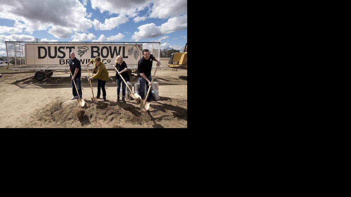 
Owners, from left, Brett Tate, Karen Tate, Camy Honoré and Brett Honoré turn some soil during the groundbreaking for the new Dust Bowl Brewing Co. brewery in west Turlock on Wednesday. The facility is being constructed at 3000 Fulkerth Road in west Turlock.
