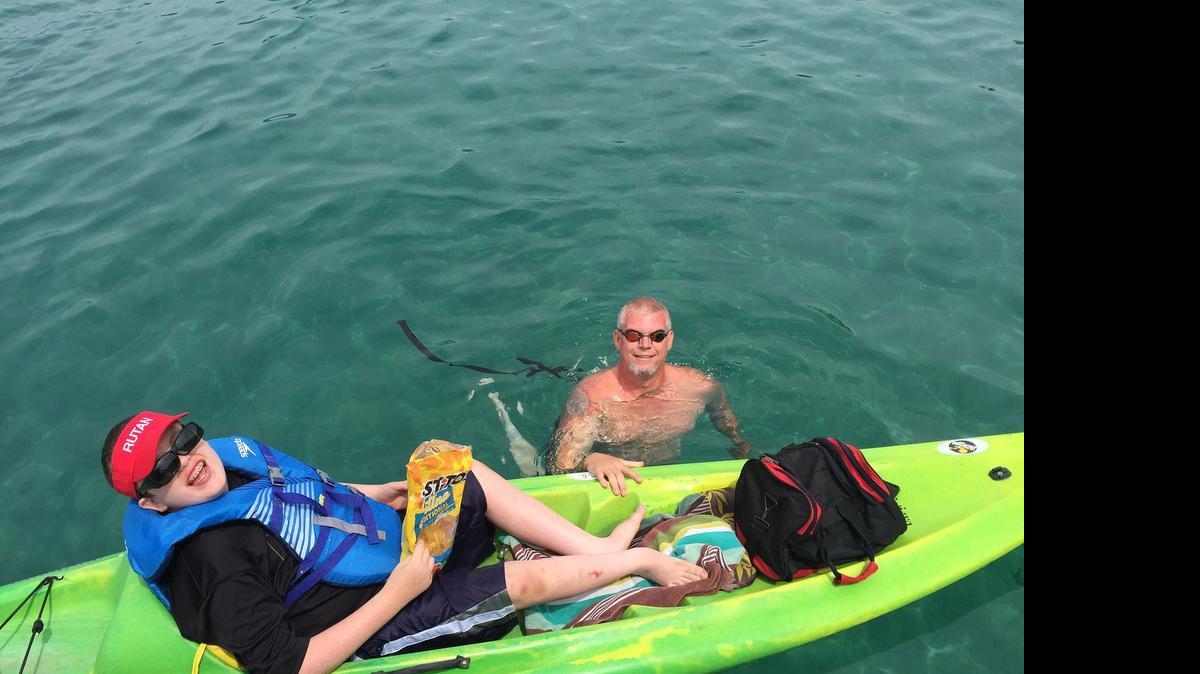 
Harry Boucher and son Max, 11, prepare for the 12-mile swim across Lake Tahoe on July 12. The pair made it 9 miles before the frigid water became too much and family members called a halt to the endeavor.
