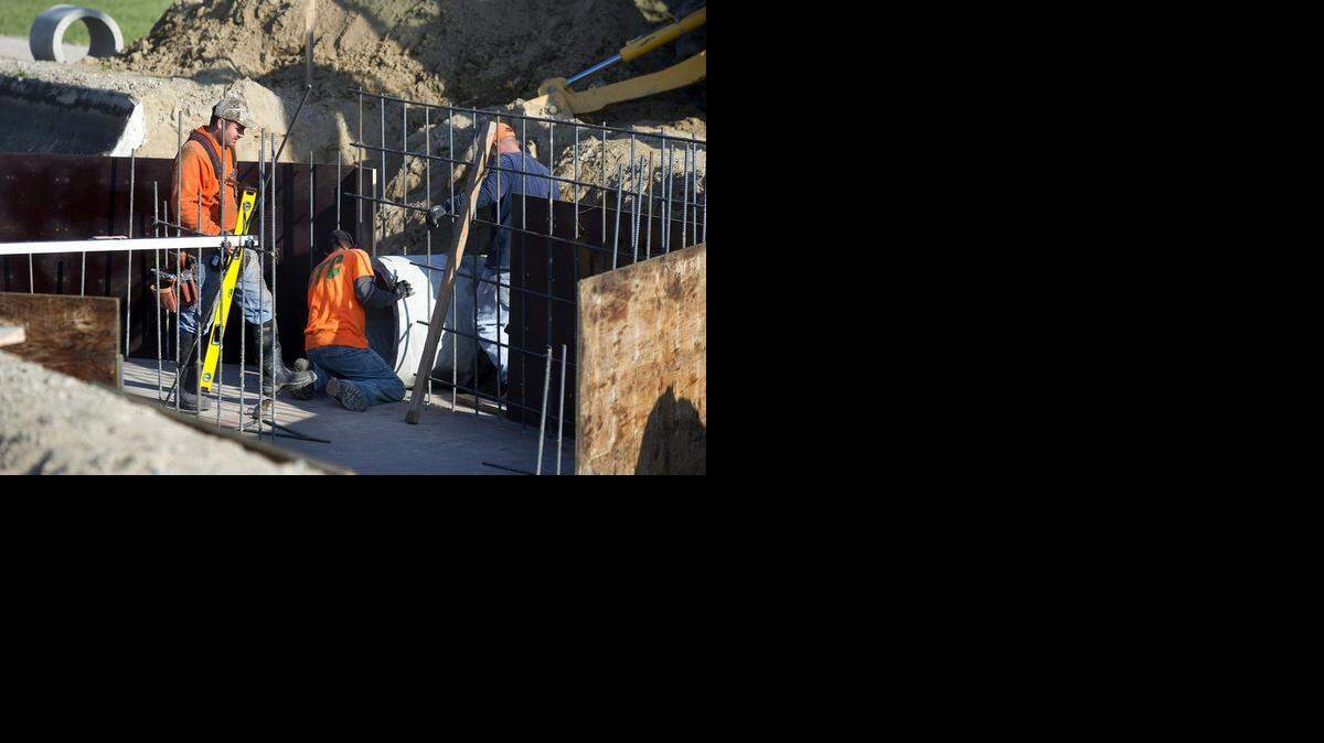 
Workers construct a canal drop on Turlock Irrigation District’s Lateral 8 canal in Hilmar.
