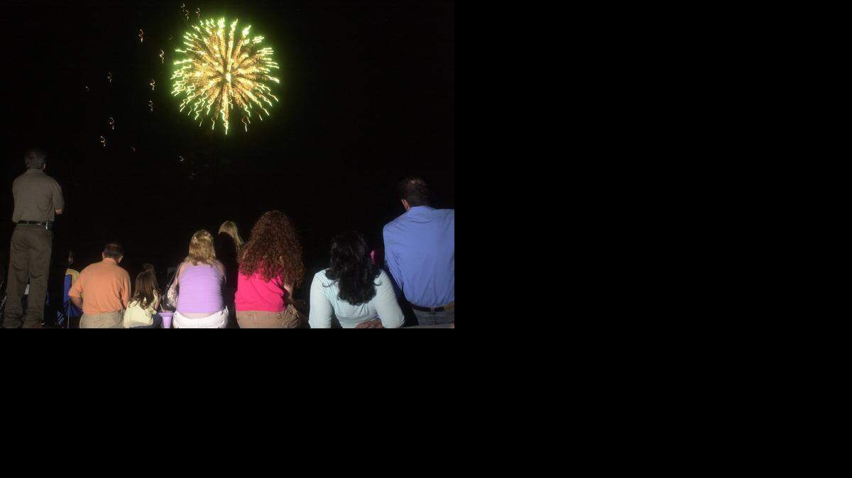
People watch the fireworks at  Stanislaus State’s Fantastic Fourth celebration in Turlock in 2005. Tuesday, the university and the Turlock Chamber of Commerce announced that the fireworks show would return to the campus after being hosted at the Stanislaus County Fairground for five years.
