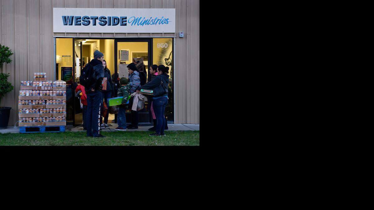 
Westside Ministries in Turlock serves dinner to those who attend its coat giveaway. 
