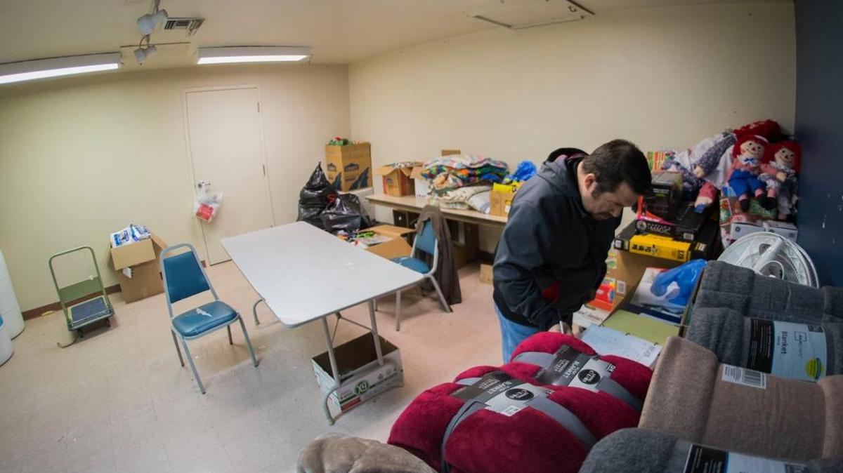 Modesto Gospel Mission director Kevin Carroll looks over a log of inventoried toys and gifts Sunday in one of the storage rooms. Carroll says many more toys are needed to provide gifts for children and adults at the mission’s annual Christmas celebration.