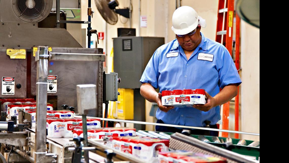 
An employee works with milk products at the Nestlé factory on Garner Road in Modesto. Nestlé’s evaporated milk plant in Modesto plans to derive all of its processing and cleaning water from the milk itself. This would reduce demand on city water by 63 million gallons a year.

