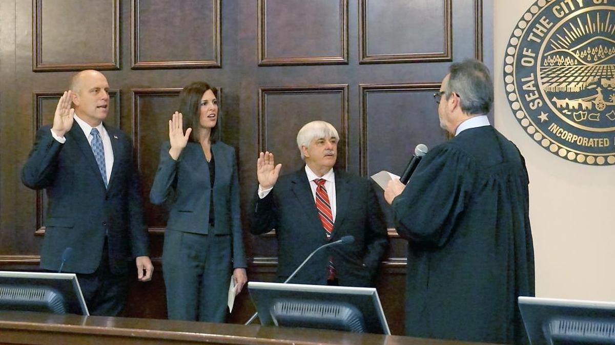 Superior Court Presiding Judge Ricardo Cordova swears in Stanislaus County Supervisors, from left, Vito Chiesa, Kristin Olsen and Jim DeMartini on Tuesday morning in the basement chambers of Tenth Street Place in Modesto.