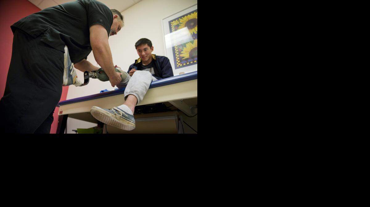 
Prosthetist Rick Wilcox sees amputee patient Bradley Duquette, who needed a new artificial leg, at Shriner’s Hospital for Children in Sacramento on Feb. 3.
