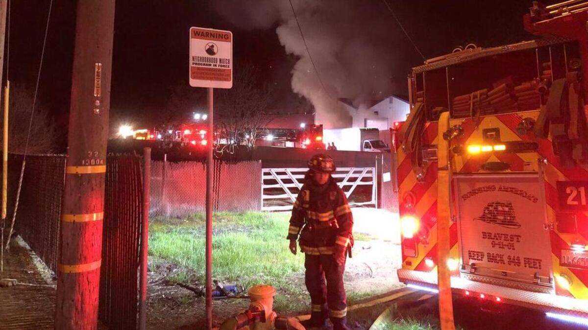 Firefighters battling a three-alarm fire at Acosta & Sons cabinet manufacturing business on Hickman Street in Waterford, California early Sunday Feb. 11, 2018.