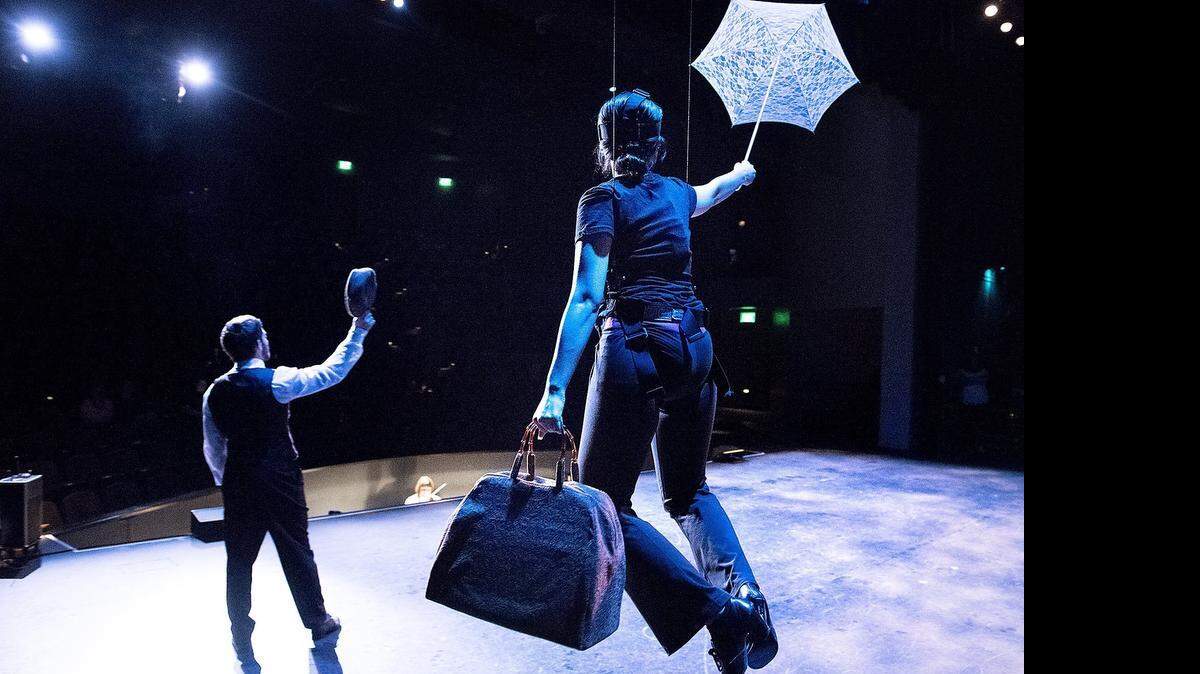 
Katya Sheth as Mary Poppins “flies” with the help of cables as Burt, played by Evan Hyatt, tips his hat during rehearsal of Modesto Christian High School’s production of “Mary Poppins”  on Wednesday.
