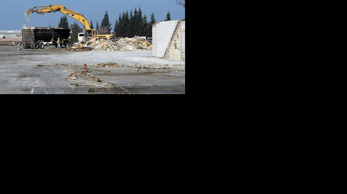 
 Crews clean up the site of the former Indalex plant in Modesto in 2011. The Bangs Avenue property is set to become home to a roller hockey center.
