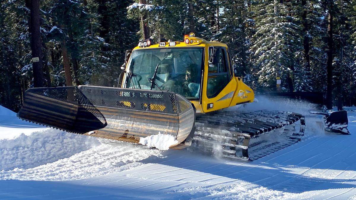 Machinery grooms the Dodge Ridge ski area in advance of its season opening on Monday, Dec. 21, 2020.