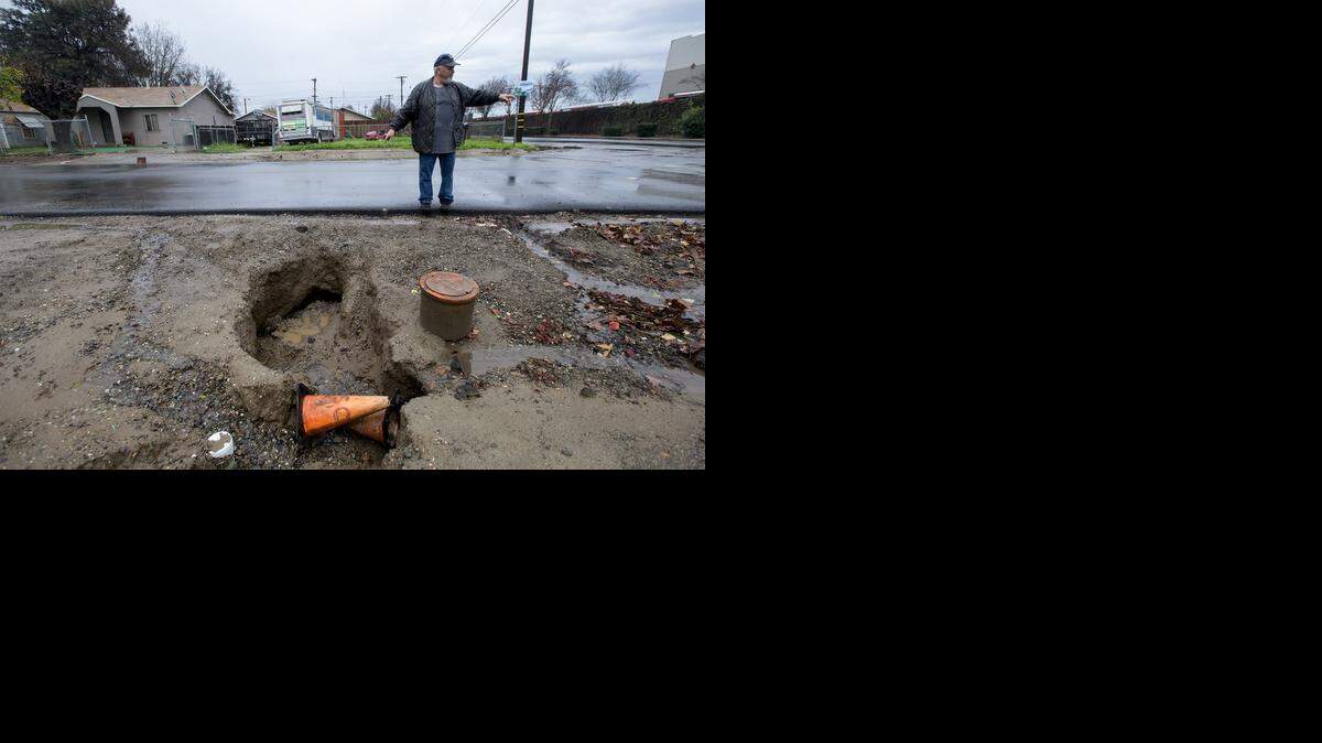 
Surface water has eroded the shoulder of the road where the new sewer line was laid in the Parklawn neighborhood in Modesto.
