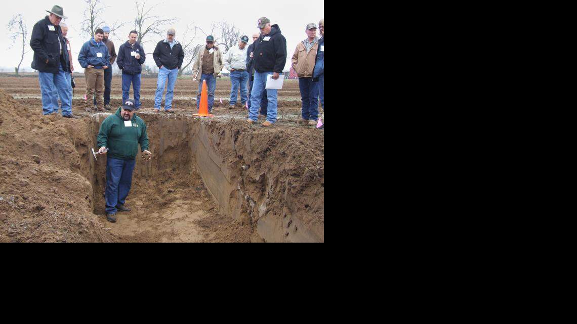 
Paul Borges of B&B Ag Consulting uses a pit to demonstrate the importance of caring for soil throughout the root zone of orchards and vineyards. He took part in a field day just south of Turlock, Calif., on Tuesday, Jan. 21, 2015. The event was sponsored by the East Stanislaus Resource Conservation District.
