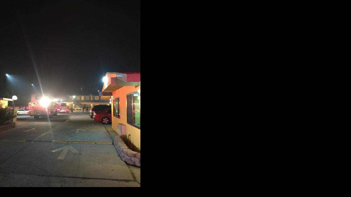 
Firefighters respond to a blaze at Apex Inn on Yosemite Boulevard late Sunday.
