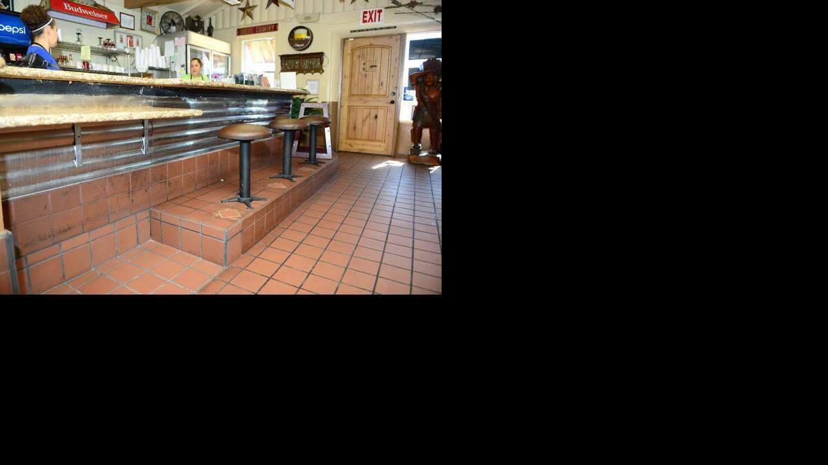
The interior of Marie’s Taco Shop shows where owner Chris Chavez lowered a portion of the bar to comply with ADA requirements in Merced last year.
