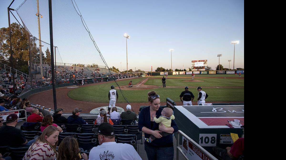 
Fans enjoy baseball action during the Modesto Nuts home opener at John Thurman Field on Thursday.
