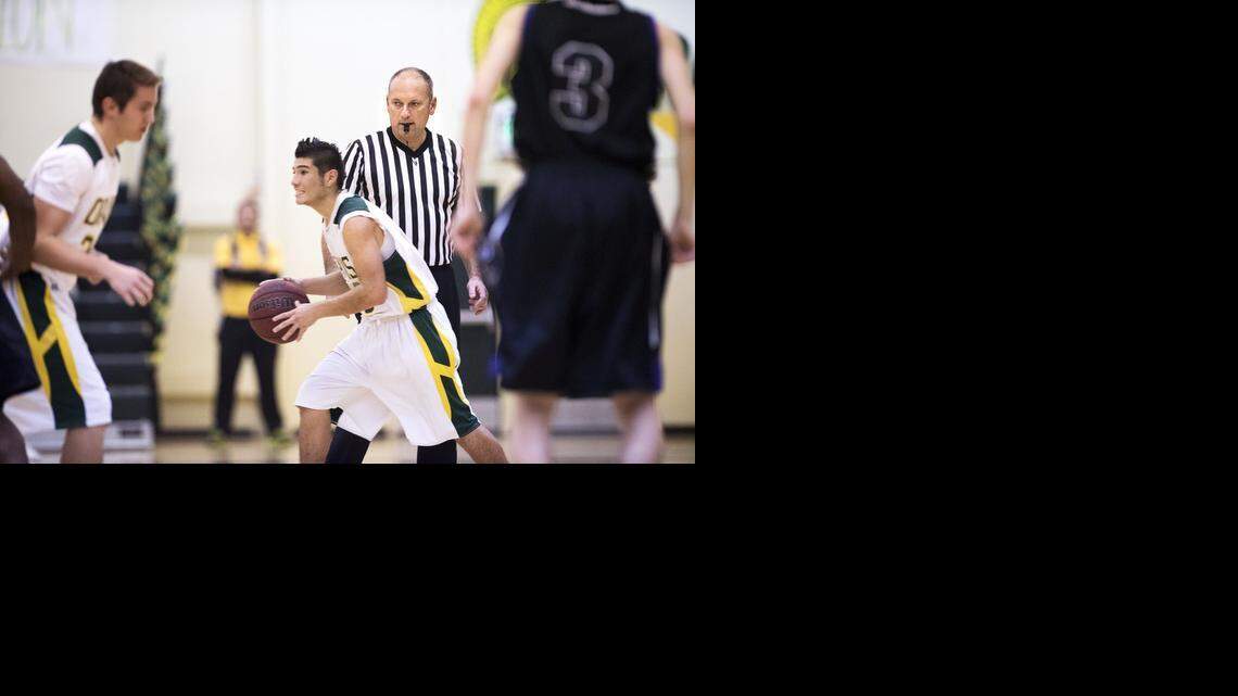 
Referee Bret Silveira calls a game between Davis and Johansen High Schools at Grace Davis High School in Modesto on Wednesday.
