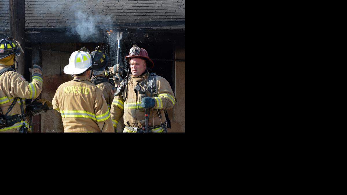 
Firefighters put out hot spots after a fire broke out at the Budget Inn on South Ninth Street on Wednesday morning. January 7, 2015 in Modesto, CA.
