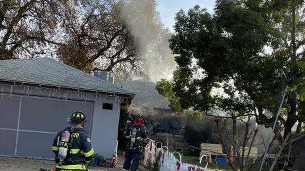 A fire displaced the residents of a house on the 2000 block of Sierra Street in Riverbank, Calif., on Dec. 27, 2020.