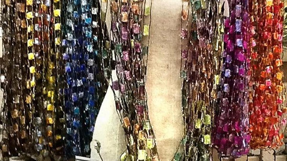 The Whisper necklaces/scarves sold at Mulberry Lane in McHenry Village are available in many colors, all of which are a little variegated and shimmery.