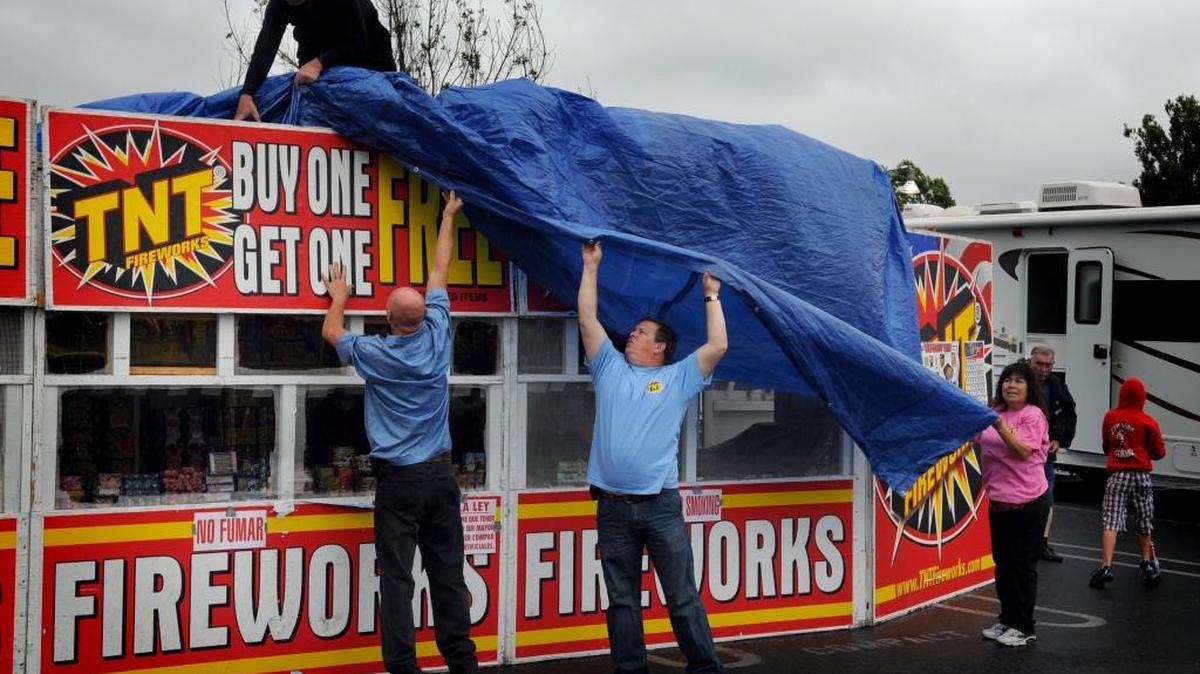 On June 28, 2011, members of Family Christian Center Church of Modesto hustle to cover their fireworks booth from getting wet at Briggsmore Avenue and McHenry Boulevard. Nearly a third of an inch fell that day, according to Modesto Irrigation District records.