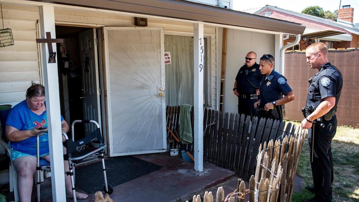 
Modesto police officers Luis Arroyo, Robert Hall and Sgt. Gary Crawford respond to a neighbor dispute in Modesto on June 25.
