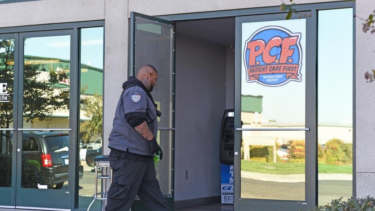 A security guard patrols at Patient Care First a medical marijuana dispensary on Charity Way in Modesto, Calif. Monday (10-23-17).