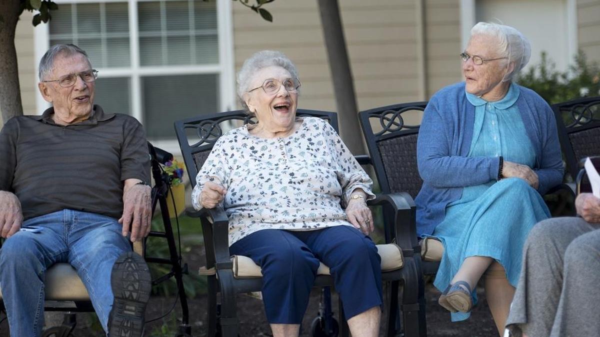 Dale Commons residents from the left, Leroy Nygaard, Shirley Horgan and Freeda Beachler react as seniors shoot a pumpkin cannon at Dale Commons senior living apartments Wednesday in Modesto.