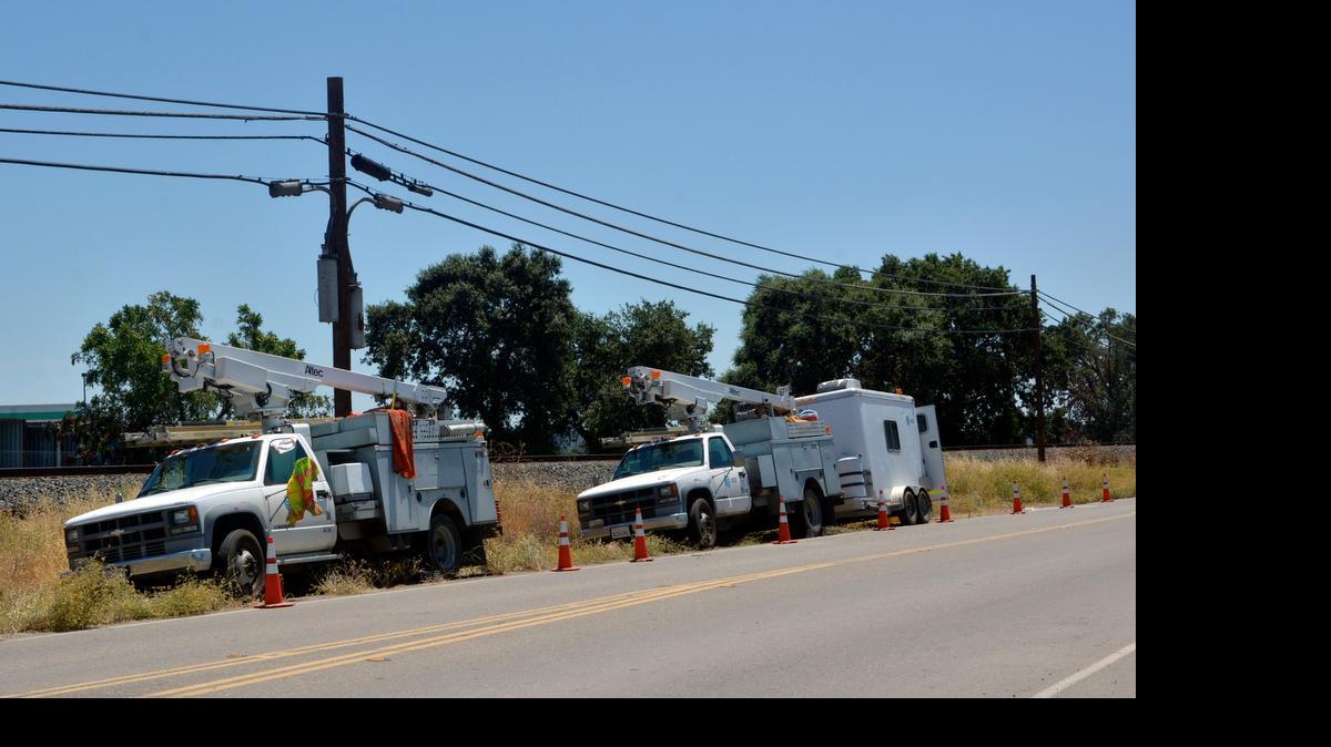 
AT&T crews work on lines Wednesday morning near South McKinley Avenue about a half mile north of French Camp Road in Stockton. The San Joaquin County Sheriff’s Department is investigating the incident as a vandalism case, because multiple fiber-optic lines were damaged. 
