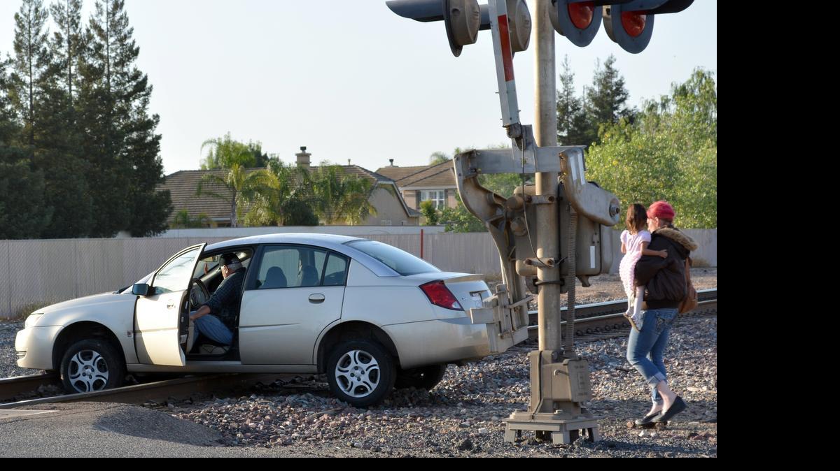 
A woman found herself in a dangerous situation Tuesday when she pulled over because her child had gotten loose in her car seat on Parker Road near the Amtrak station in east Modesto. She leaned back to secure the child, realized the car was rolling forward and tried to hit the brake. She hit the gas instead, sending the car through a barrier and onto the Burlington Northern Santa Fe tracks, where it high-centered. She and the child got out safely. Fortunately, Tom Smith of the Eastside Mosquito Abatement District happened to be there and called the railroad to halt any trains scheduled to come through. Modesto police and the California Highway Patrol responded.
