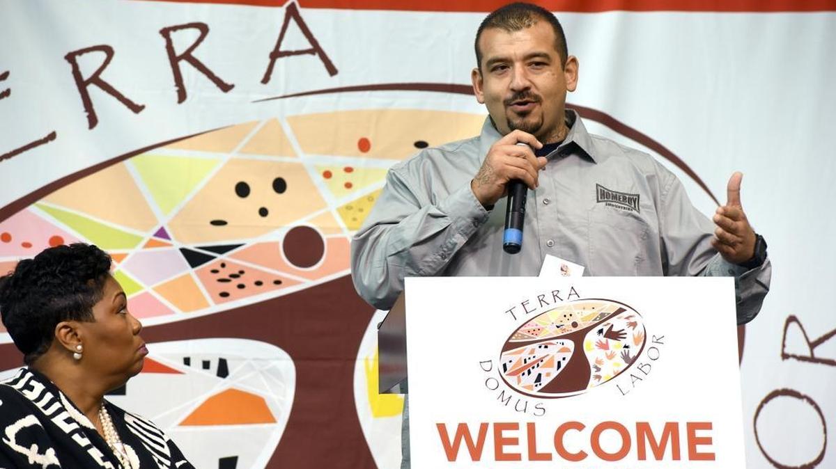 Jose Arrellano, with Homeboy Industries, speaks during a panel on racism as Pastor Traci Blackmon looks on Friday at the World Meeting of Popular Movements at Central Catholic High School in Modesto.