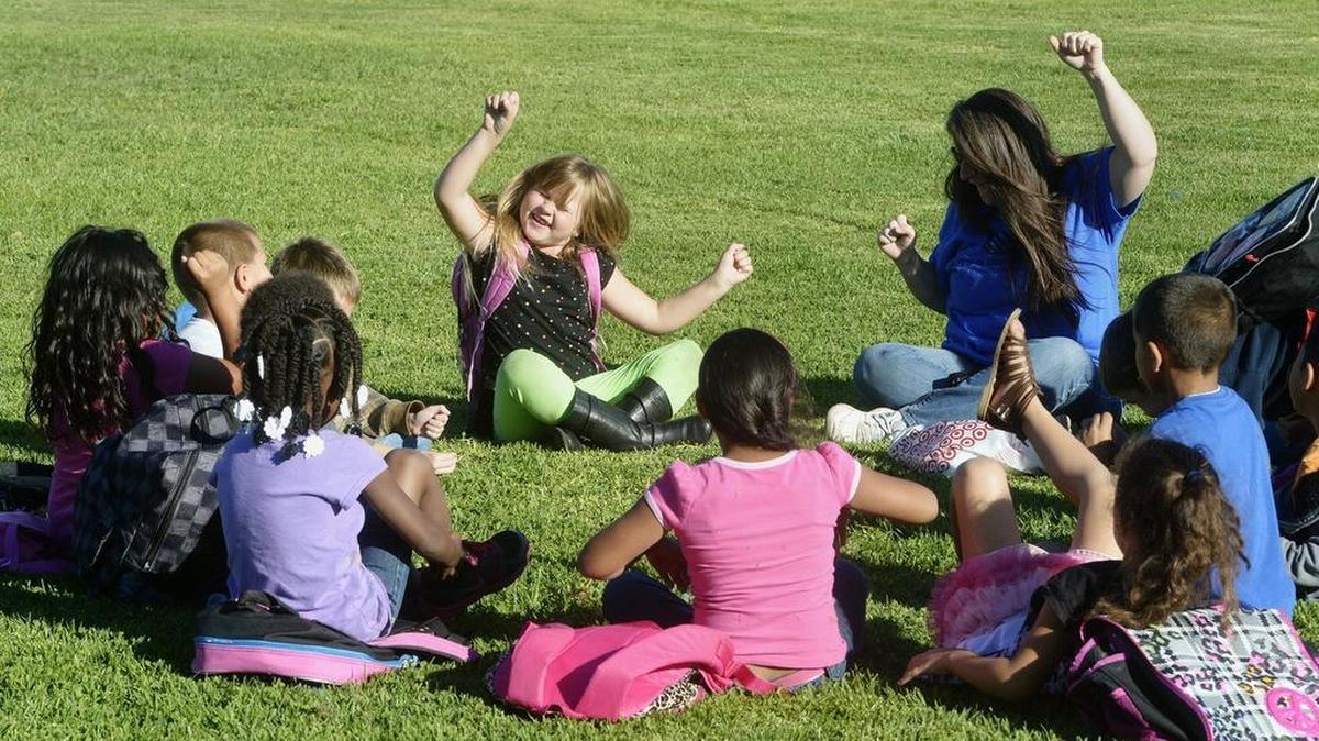 
Madison Souders rocks out as she and other students play a copycat game during the Boys and Girls Clubs of Stanislaus County’s after-school program in 2013. The second annual pingpong tournament is being held Oct. 9 to benefit the club. 
