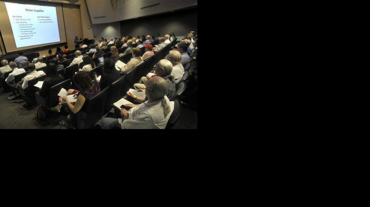
Under a projected slide outlining water supplies, audience members listen to Jeanine Jones, interstate resources manager for the California Department of Water Resources, during “The Challenges of the 2015 Drought: Water Project Operations” public presentation at the Alice Peters Auditorium at California State University, Fresno, on Thursday morning.
