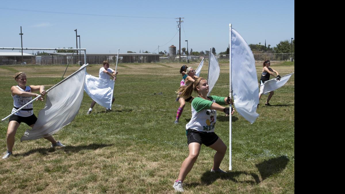
Alayna Ryan, right, practices her flag techniques during training Monday for the Vanguard Cadets at Denair High School in Denair.
